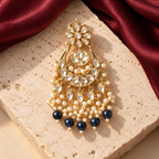 Jewellery styled on ivory travertine with burgundy silk