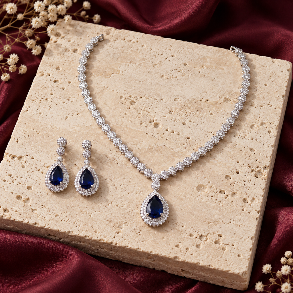 Royal Sapphire necklace and matching earrings on ivory stone and burgundy silk