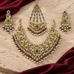 Jewellery styled on ivory travertine with burgundy silk