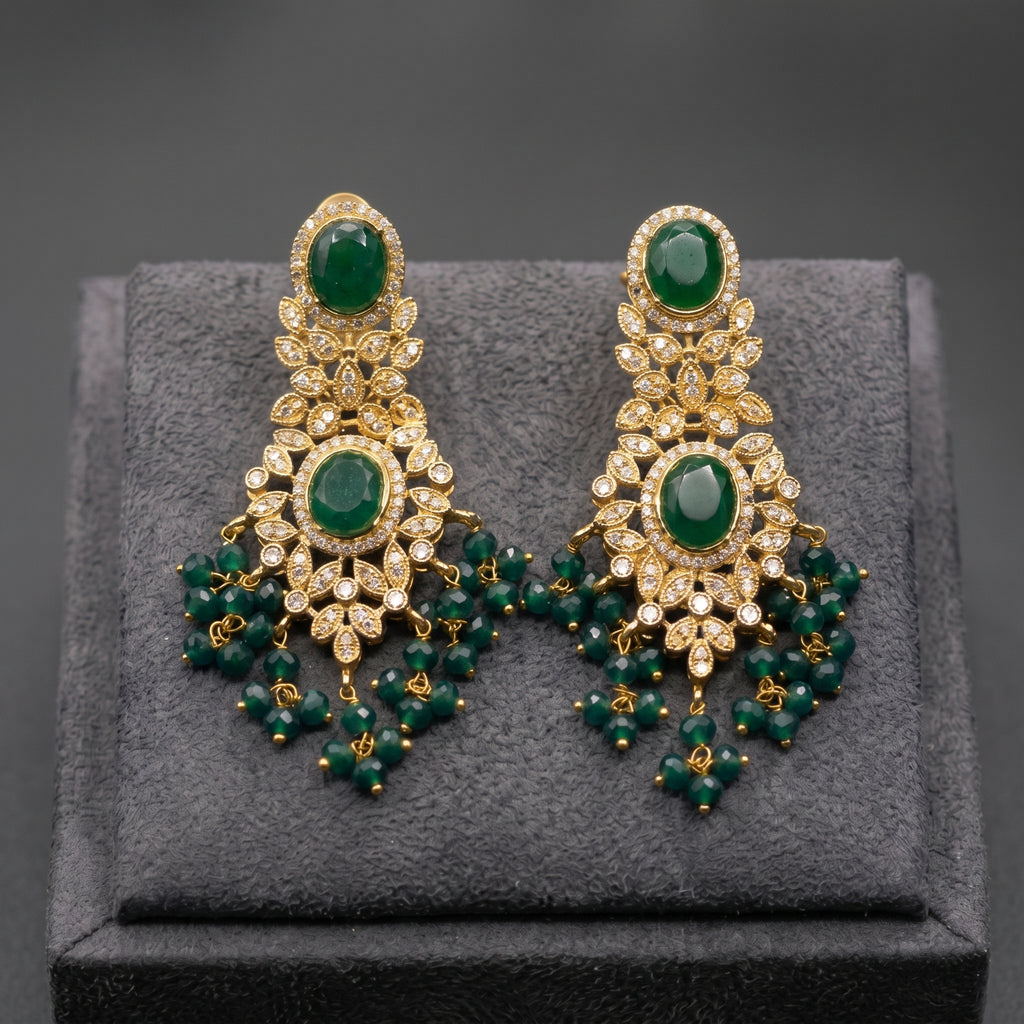 Emerald Green Oval Stone Earrings close-up detail — artificial earrings by Jashan Jewels